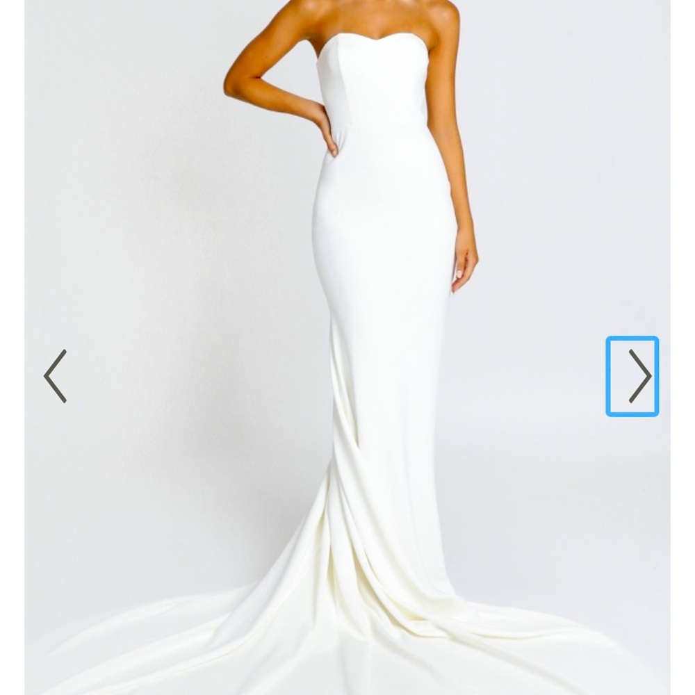 Brand New with tags on, never worn. White basic wedding gown.